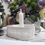 heart shaped white chamberstick candle holder with white candle