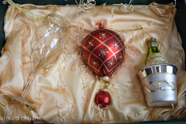 Christmas gift set of 3 hanging decorations , a champange glass, a hot air balloon and a champagne in an ice bucket.