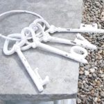 White cast iron keys with the letters L O V and E in place of the key shapes