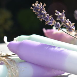 violet and mint dip dye candles with sprig of lavender tied with string