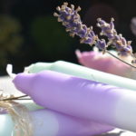 violet and mint dip dye candles with sprig of lavender