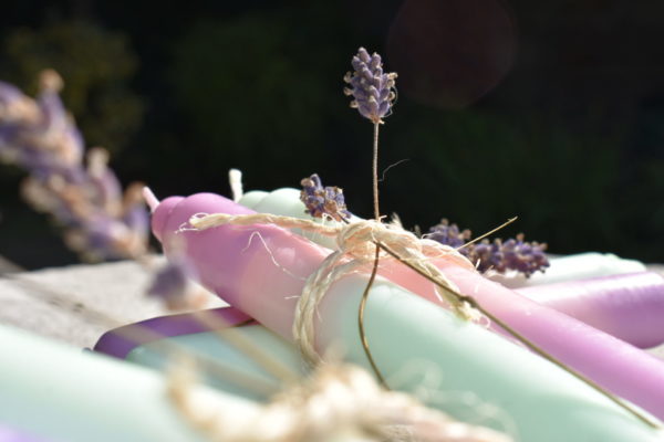 dip dye candles in pairs in violet, mint and pink tied with twine and a sprig of lavender