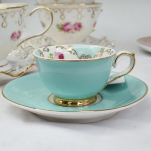 espresso cup and saucer in turquiose gold with pink flower