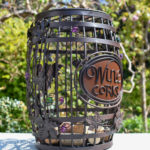 barrel shaped wine cork holder with wine corks in the garden