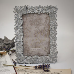 picture frame in grey with flowers and butterflies