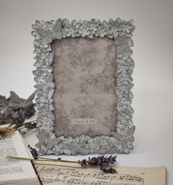 picture frame in grey with flowers and butterflies