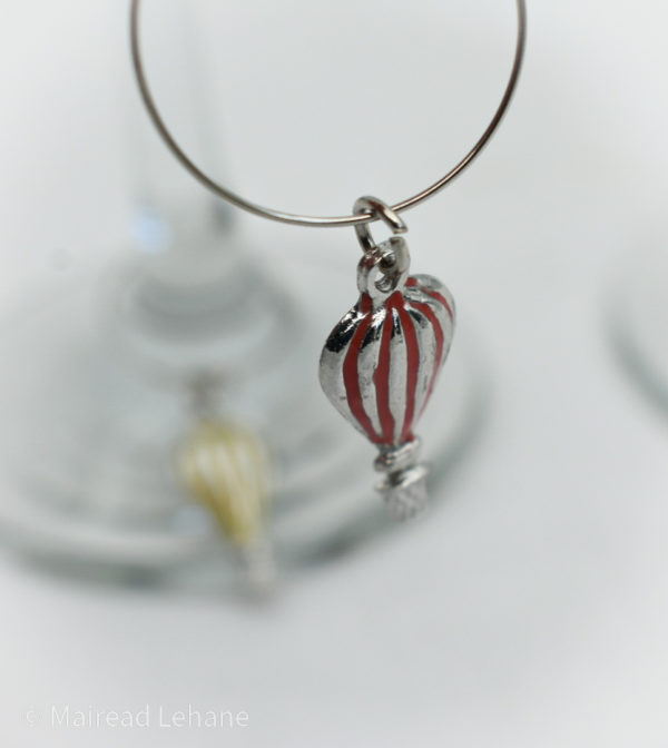 close up of red hot air balloon wine glass charm