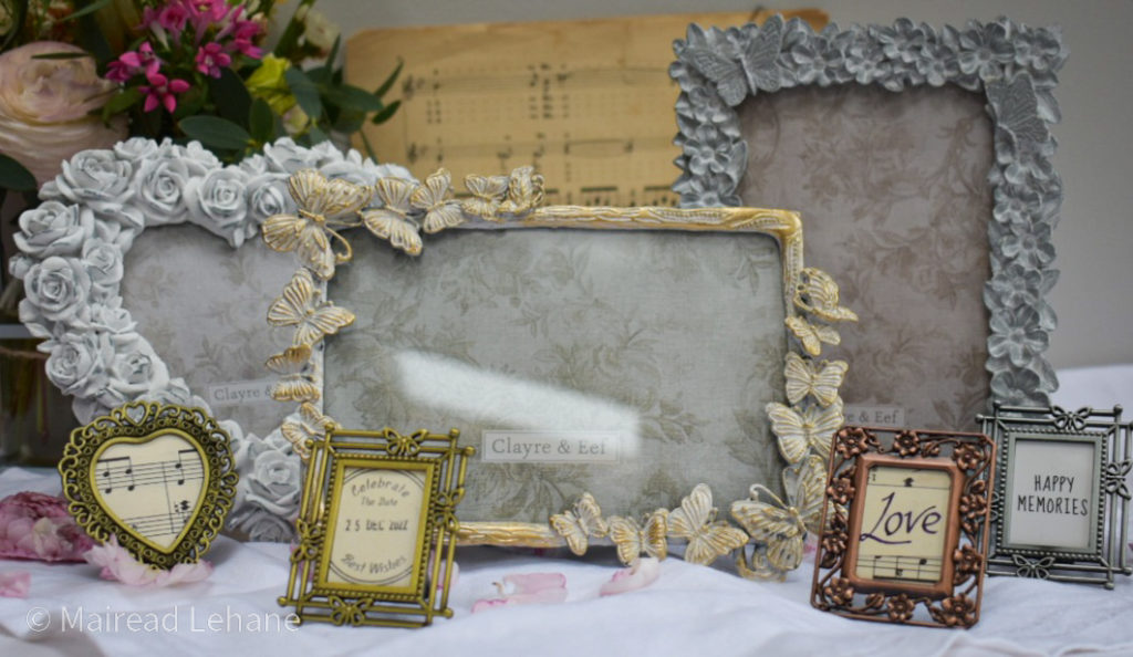Photo frames grouped together with miniature frames