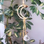 suncatcher with crescent moon and two crystals