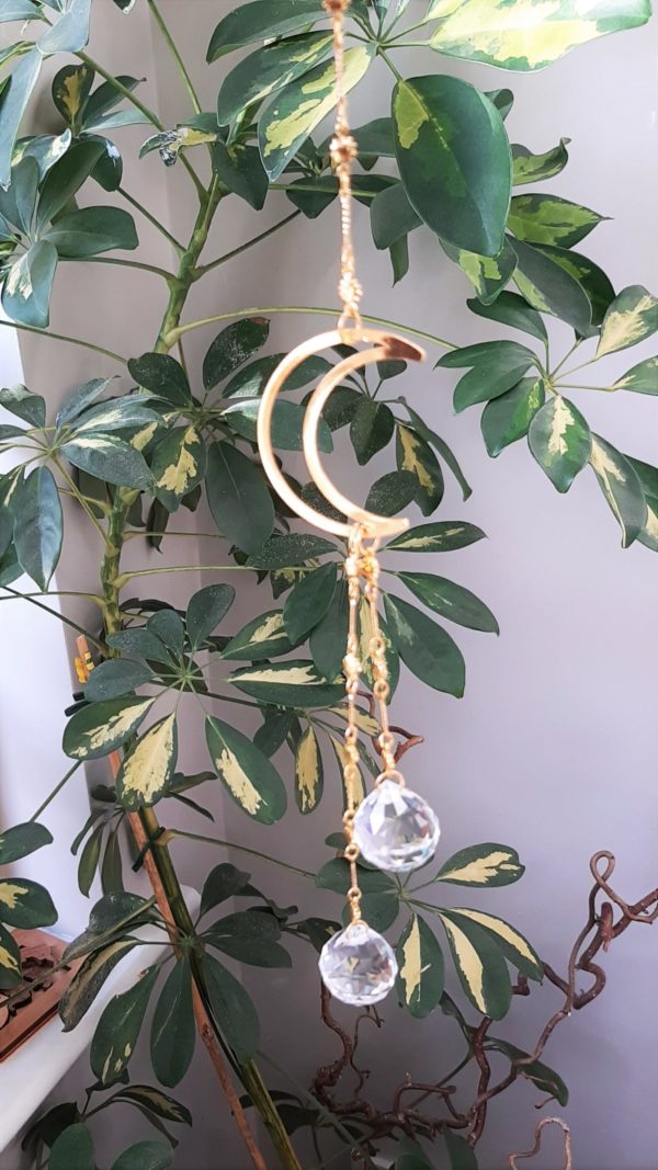 suncatcher with crescent moon and two crystals