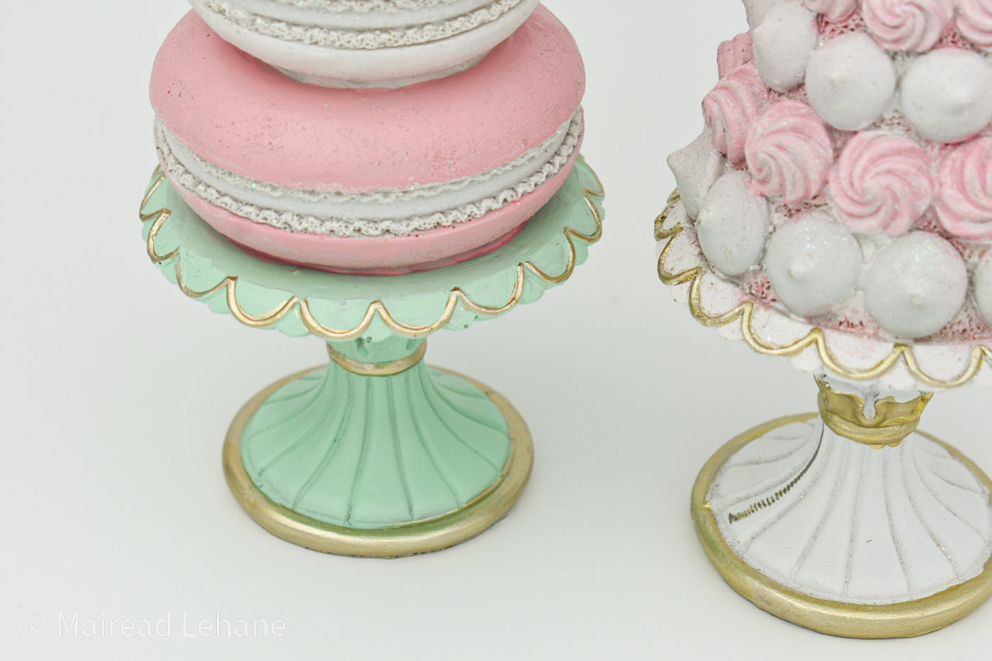 cose up of stands of cone trees, macaron and candy