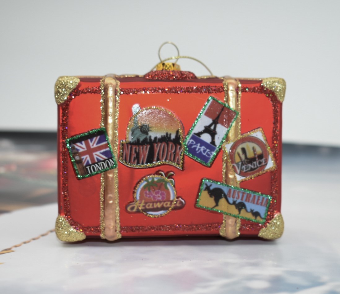 vintage sytle suitcase decoration in red with travel stickers on the front of London, New York, Paris, Venice or Hawaii or Australia