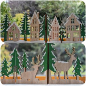collage of 2 festive wooden panel decorations, one with a village scene and the other with reindeer