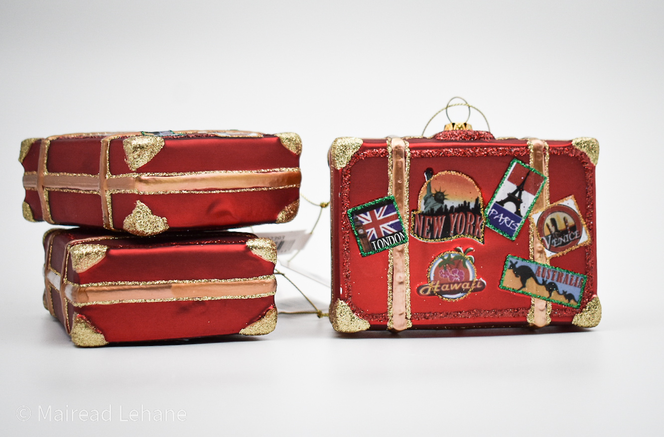 3 vintage style suitcase decorations, two lying flat and one upright